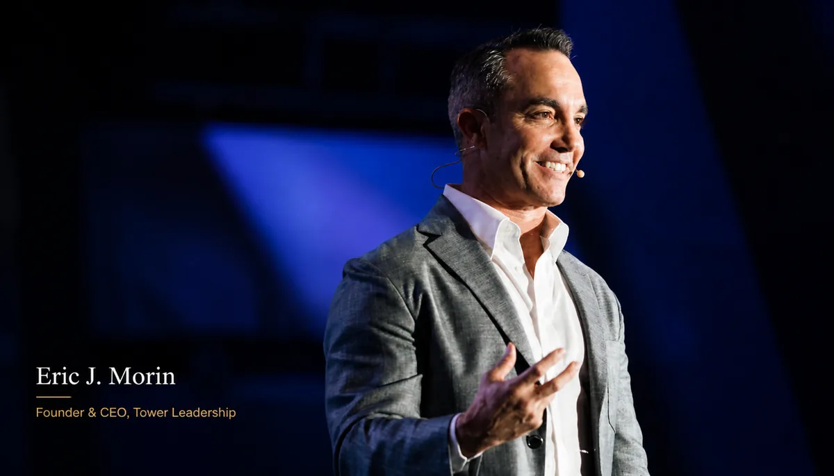 Eric J. Morin, Founder and CEO of Tower Leadership, speaking on stage.