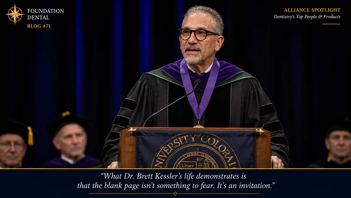 Dr. Brett Kessler speaking at a university podium in academic robes.