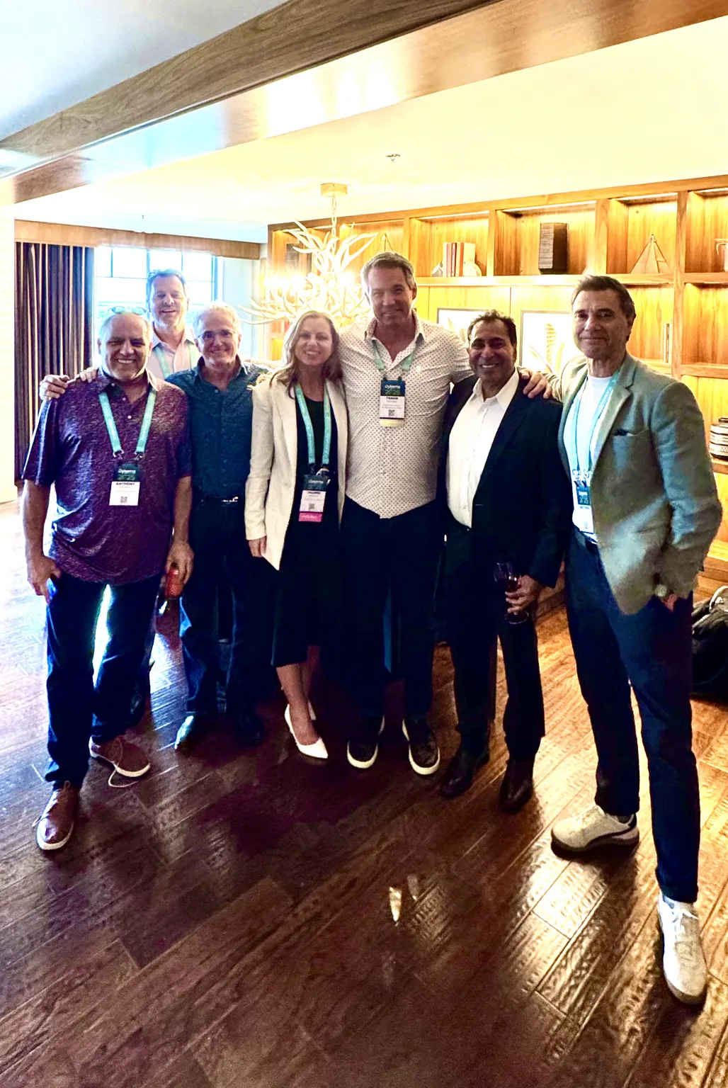 Attendees at the Dykema DSO Conference standing together in the hotel lobby.
