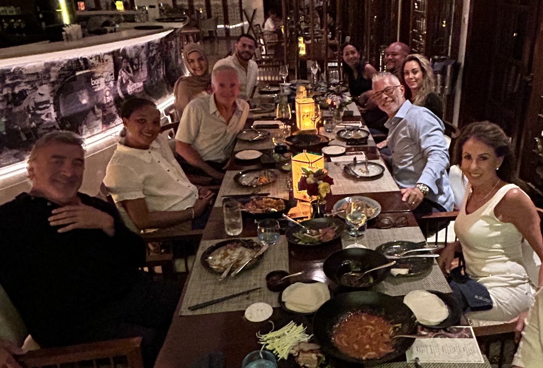 Long-table group dinner on the final night