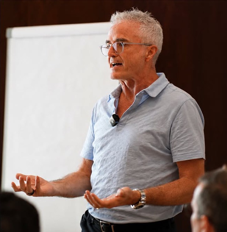 Dr. Jim Arnold leading a faculty-led discussion at a flip chart