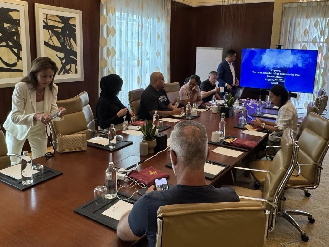 A small-group practice strategy session around the boardroom table